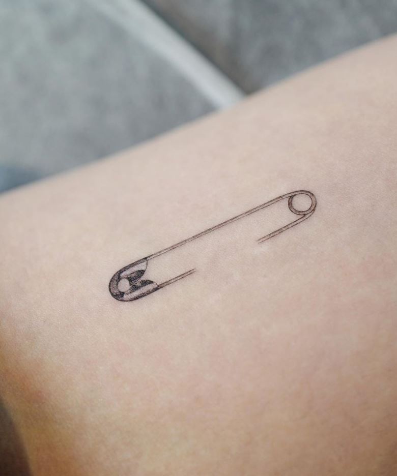 Hooked Needle Tattoo
